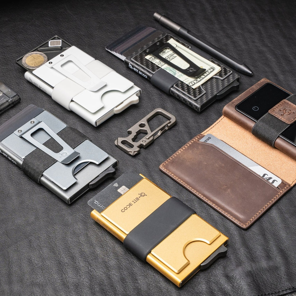 CODE 118 wallets with the Stash Tray, cash clips and leather case on a leather desk