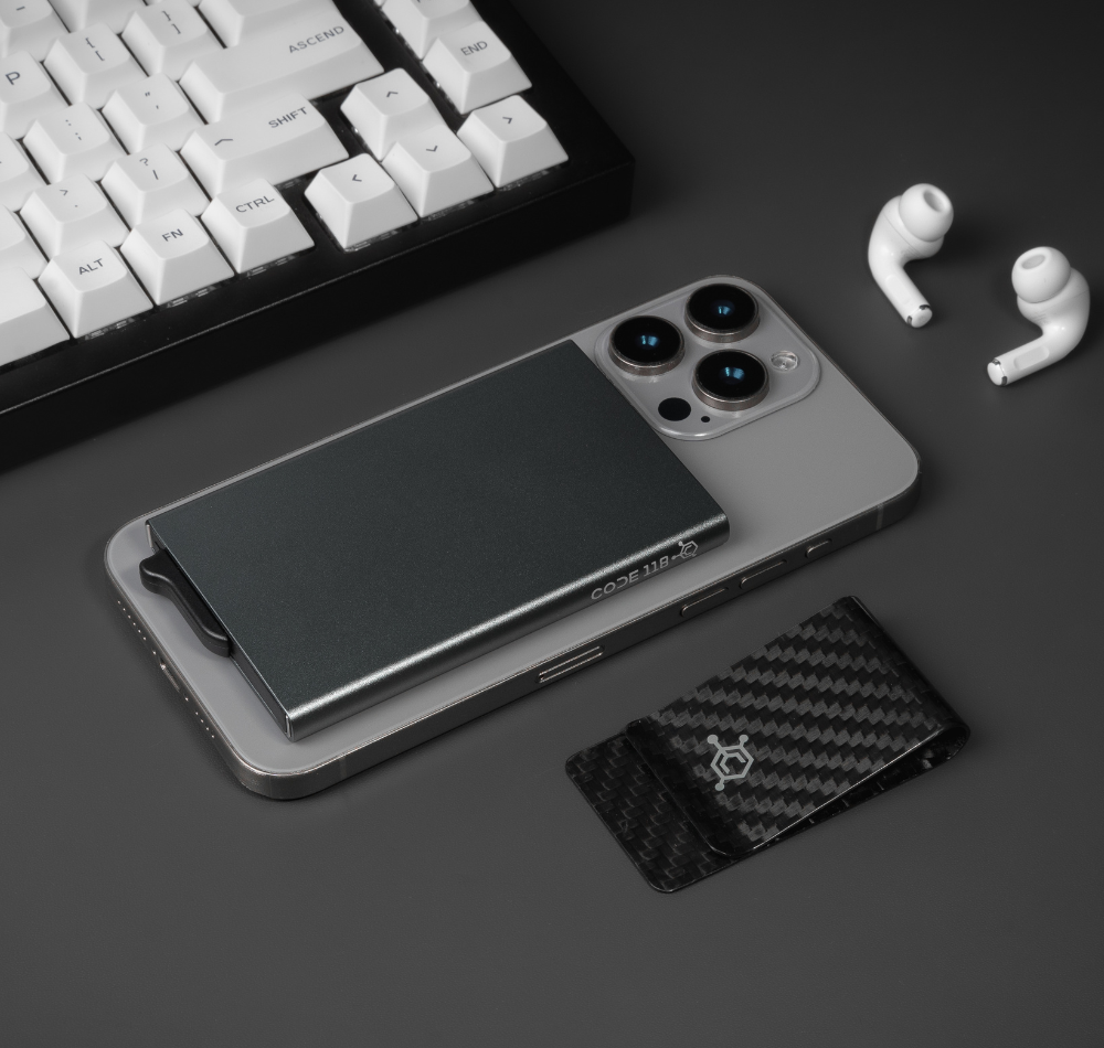 CODE 118 Wallet for MagSafe on the back of an iPhone on a desk